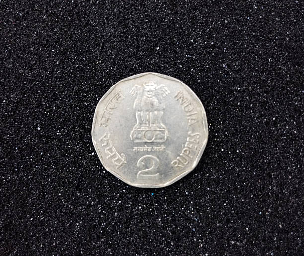istock Indian Two Rupee Coin on a Glittering Background 2236778412