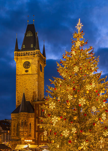 istock Illuminated Christmas tree and Prague Old Town Hall tower at dusk 2236780397