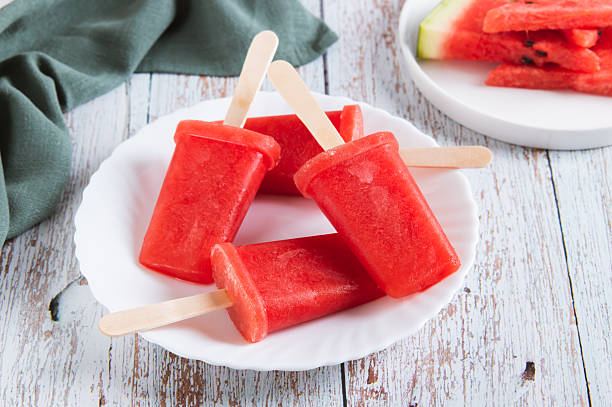 istock Red watermelon popsicle ice cream on a plate on the table 2236783423
