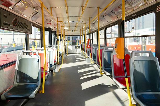 istock Interior of a bus with empty seats and yellow trolleys 2236785294
