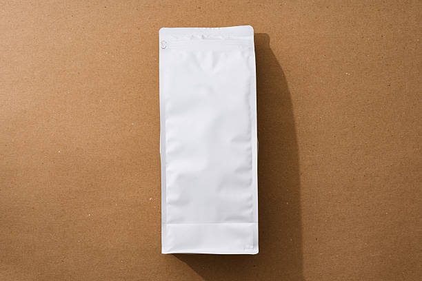 istock Blank package with coffee beans for your design on beige background 2236785470