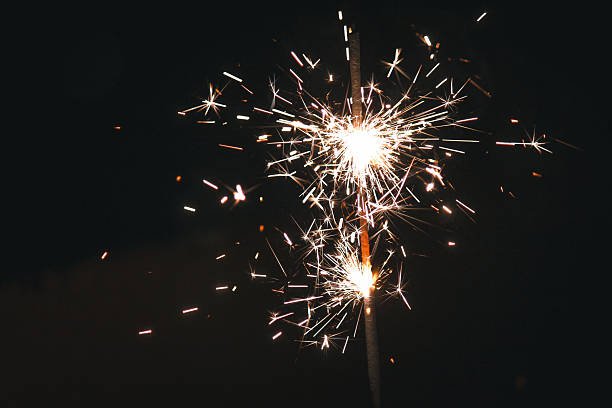 istock sparkler in the dark, festive glow 2236790752