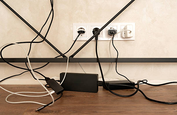istock Workplace organization. Messy cables and wires under desk in home office interior, symbolizing electricity connection, technology and disorganized workspace. 2236791072