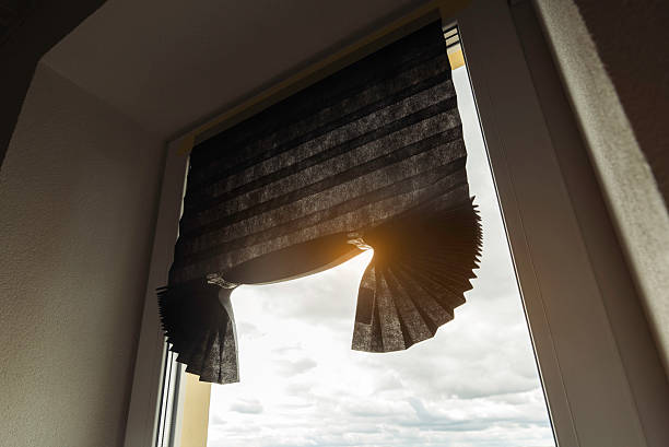 istock Temporary pleated paper blinds on window with sunlight, affordable window covering solution for privacy, comfort and home interior decoration. 2236792005