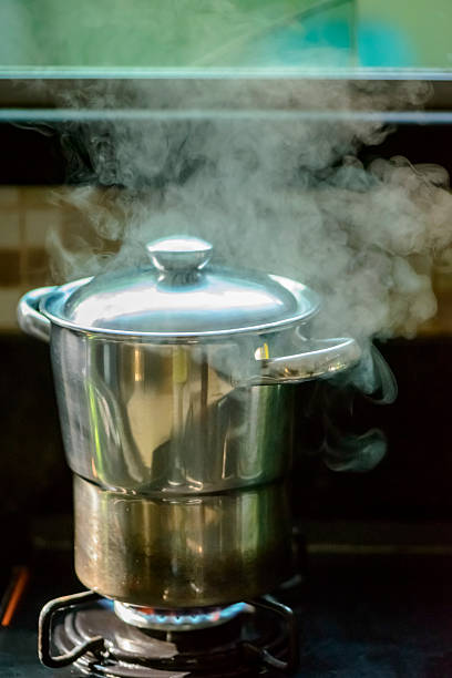istock Traditional Cuscuz Steamer Pot with Steam on Gas Stove 2236792172