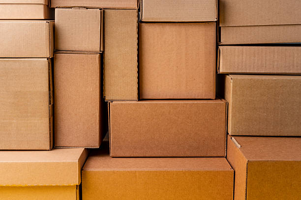 istock Cardboard boxes stacked in a pile as a background 2236792589