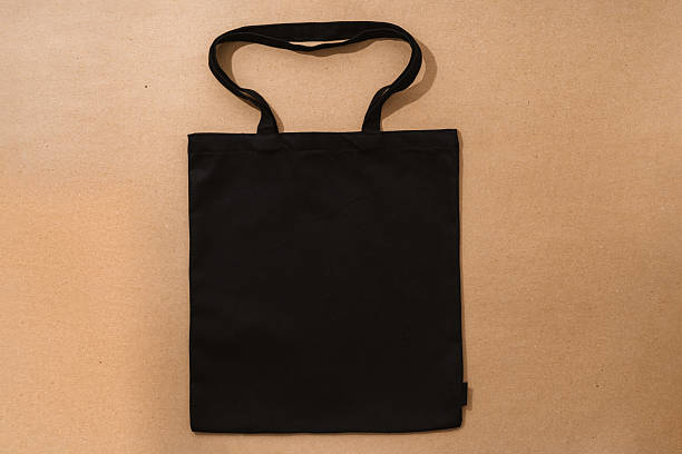 istock Textile shopping bag on beige background flat lay 2236793942