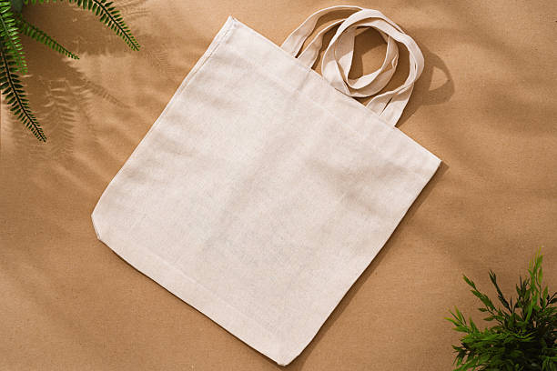 istock Textile shopping bag on beige background flat lay 2236794351
