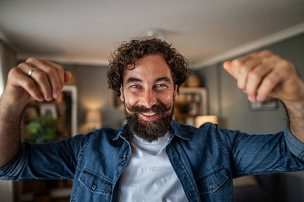 istock Excited mid adult man celebrating success with joyful expression 2236794513