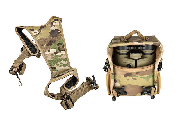 A set of hunting binoculars and a harness in camouflage.