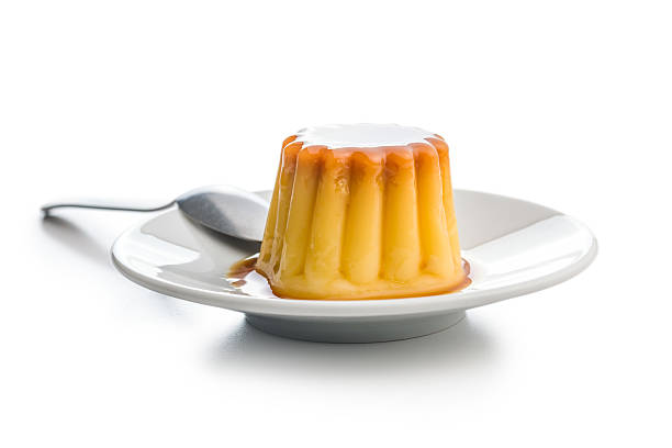 istock Vanilla pudding with caramel sauce isolated on white background. 2236801722