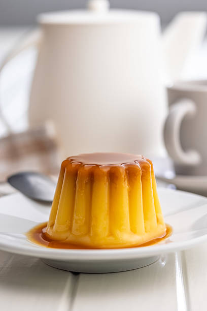 istock Vanilla pudding with caramel sauce on plate on white table. 2236801778