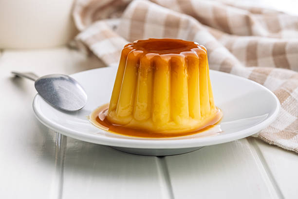 istock Vanilla pudding with caramel sauce on plate on white table. 2236801779