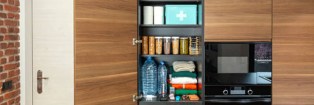 istock Emergency pantry with non perishable food, water and first aid kit in kitchen. 72 hour survival kit. 2236806355