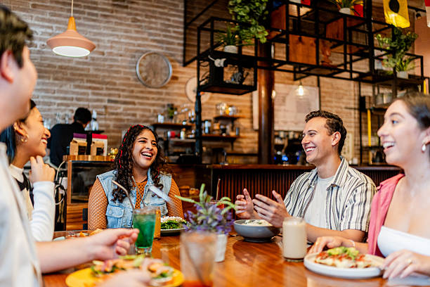 istock Young friends talking during lunch at restaurant 2236808440