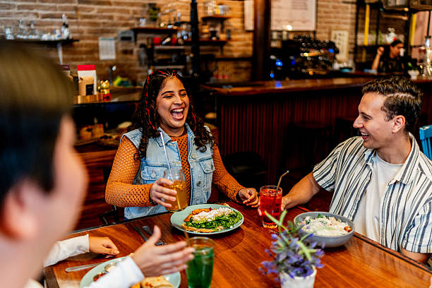 istock Young friends talking during lunch at restaurant 2236808485