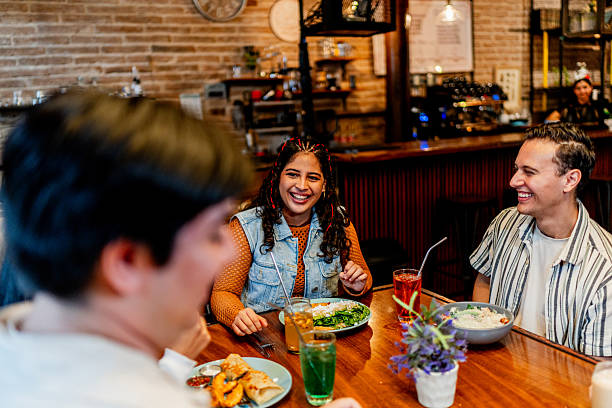 istock Young friends talking during lunch at restaurant 2236808488