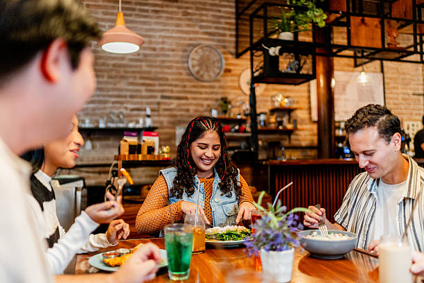 istock Young friends eating during lunch at restaurant 2236808496