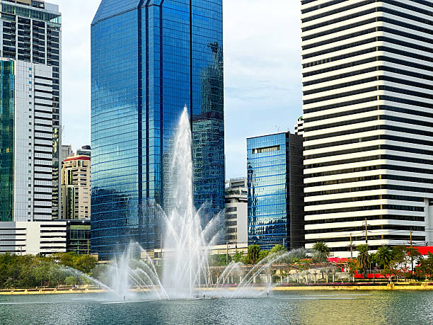Cityscape view of Bangkok with tall buildings from Benchakitti Park in Bangkok, Thailand