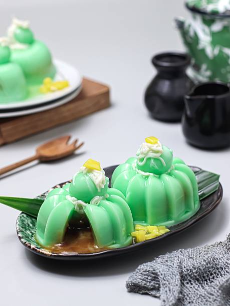 istock Klepon pudding. Creative dessert pudding inspired by Indonesian klepon, filled with liquid palm sugar and topped with shredded coconut pudding 2236811600