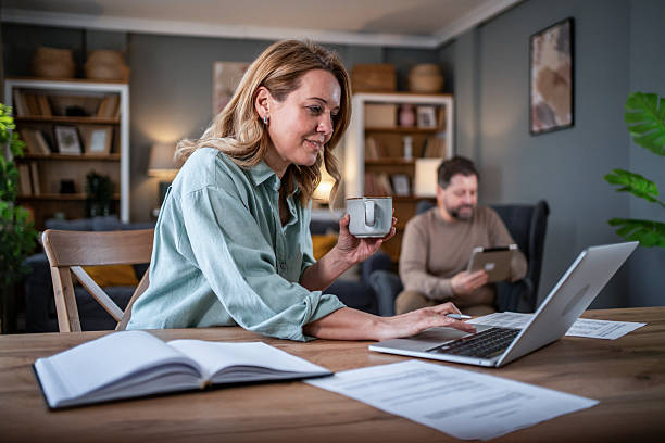 istock Woman working from home enjoying coffee with husband 2236814140