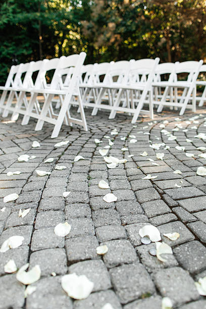 istock White wooden chairs for guests in the park 2236823053