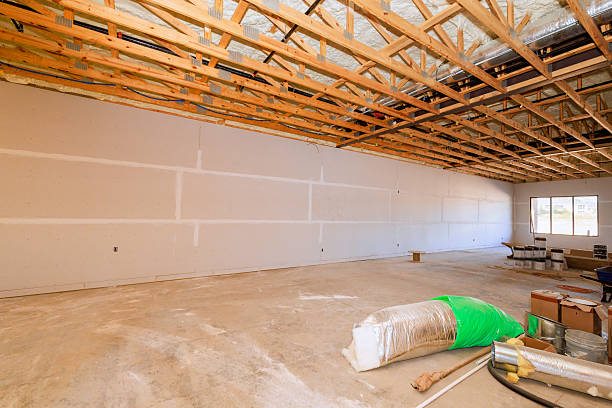 istock Interior construction site showing unfinished walls and exposed beams in spacious room during renovation project 2236824148