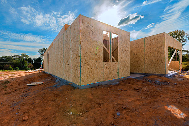 istock New house under construction with wooden frames on work day in an open area 2236824155