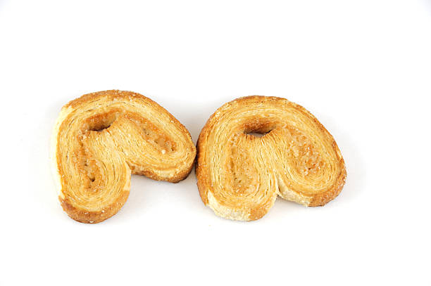 istock fresh cooked palmiers isolated on white background 2236826878