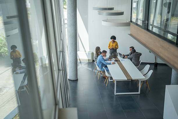 istock Business team collaborating on project in modern office 2236827245