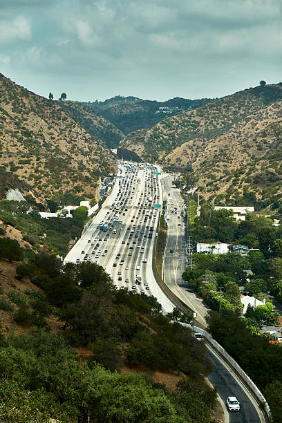 istock Freeway with heavy traffic and the mountain 2236829268