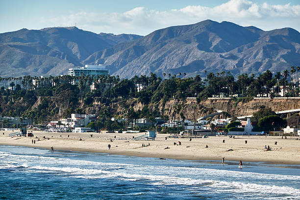istock Scenic view of beach with waves crashing 2236829420