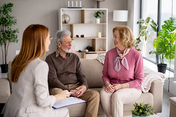 istock Elderly couple sharing a joyful moment with a consultant 2236829423