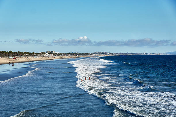 istock Scenic view of beach with waves crashing 2236829428
