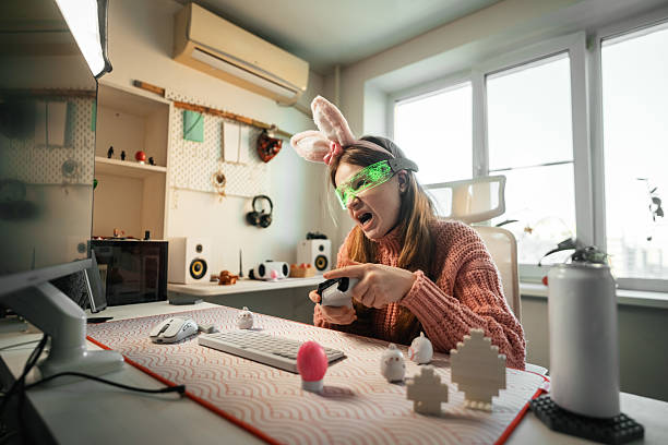 istock Easter gaming setup combines traditional elements with contemporary lifestyle. Colorful eggs and gaming accessories create unique holiday environment, showing how old traditions adapt modern trends. 2236829772