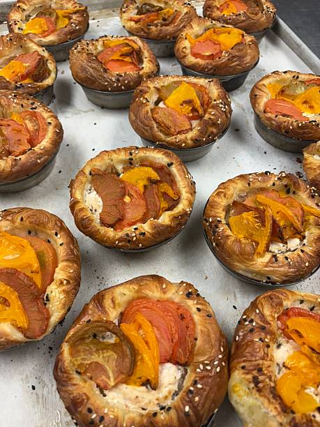 A delightful fruit tart with a buttery, flaky crust filled with creamy custard and topped with an array of fresh, vibrant fruits. Perfectly balanced between sweet and tangy, making it irresistible