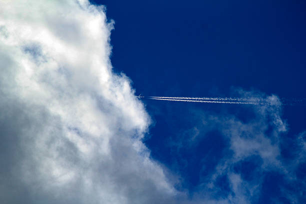 istock A plane's contrail streaks across a vibrant blue sky 2236836810