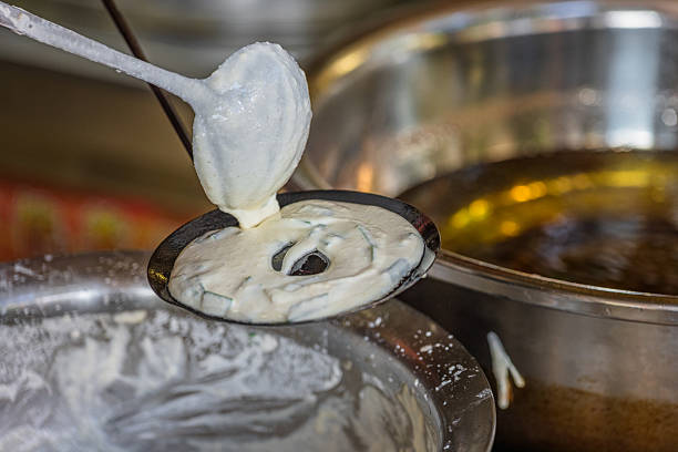 istock The Process of Making Fried Dough: Pouring Batter into a Circular Mold Before Frying 2236837063