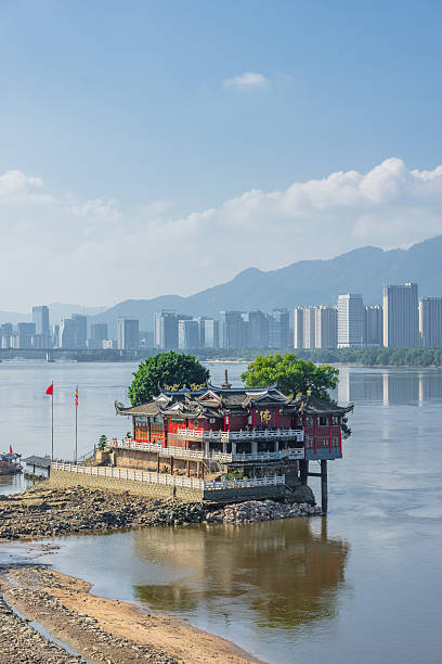 istock Ancient Architecture on a River Island with Modern City Skyline in the Background 2236837430