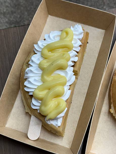 Crispy, golden waffles topped with creamy ice cream, creating a perfect balance of warm and cold, crunchy and smooth. A delightful dessert or breakfast treat, with toppings like fruits or syrup.