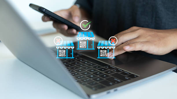 istock A man using a smartphone and a laptop with digital e-commerce store icons, online business selection, virtual marketplace, technology choice, startup innovation, and electronic shopping concept. 2236839280