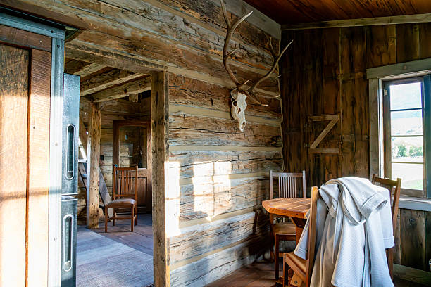 istock Rustic cabin interior. Sunlight reveals wooden details. 2236839293