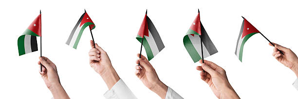 The Jordan flag in hand in different angles on a white background.
