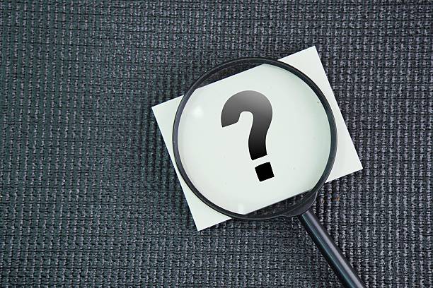 istock Magnifying glass and question mark signs and mark it correct or found on dark background. 2236840142