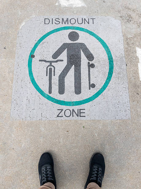 istock Dismount zone sign painted on urban pavement 2236840410