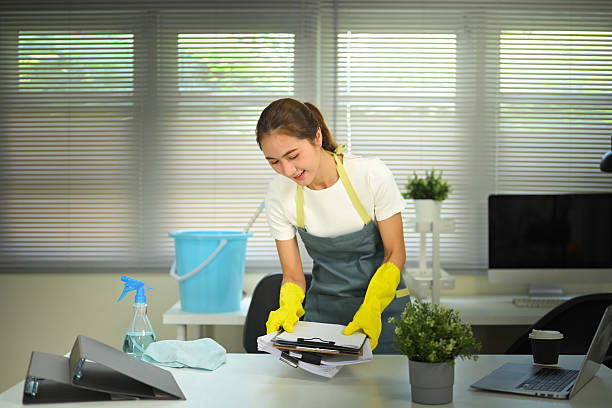 istock Female worker tidying documents on a modern desk 2236841137