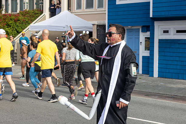 San Francisco, CA, USA - May 14, 2022: This 12K race is one of the largest and oldest running events in the world. It attracts more than 50,000 runners and 100,000 spectators every year. This race includes both serious runners and those out for a fun Sunday run. Many wear fun and funky costumes to show their spirt.