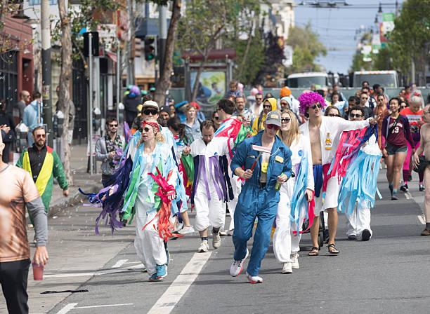 San Francisco, CA, USA - May 14, 2022: This 12K race is one of the largest and oldest running events in the world. It attracts more than 50,000 runners and 100,000 spectators every year. This race includes both serious runners and those out for a fun Sunday run. Many wear fun and funky costumes to show their spirt. You will also find a few people in just their birthday suit.
