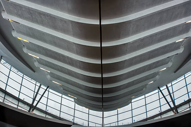 istock modern ceiling with a series of undulating, layered concrete or plaster panels, creating a dynamic, wave-like effect 2236845543