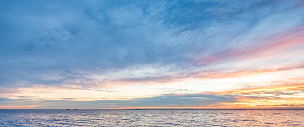 istock A wide panoramic sky with sunset clouds that evoke a sense of calm and tranquility. 2236845977